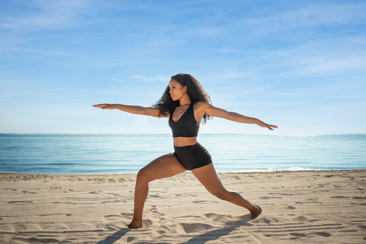 girl doing yoga at garza blanca cancun beach